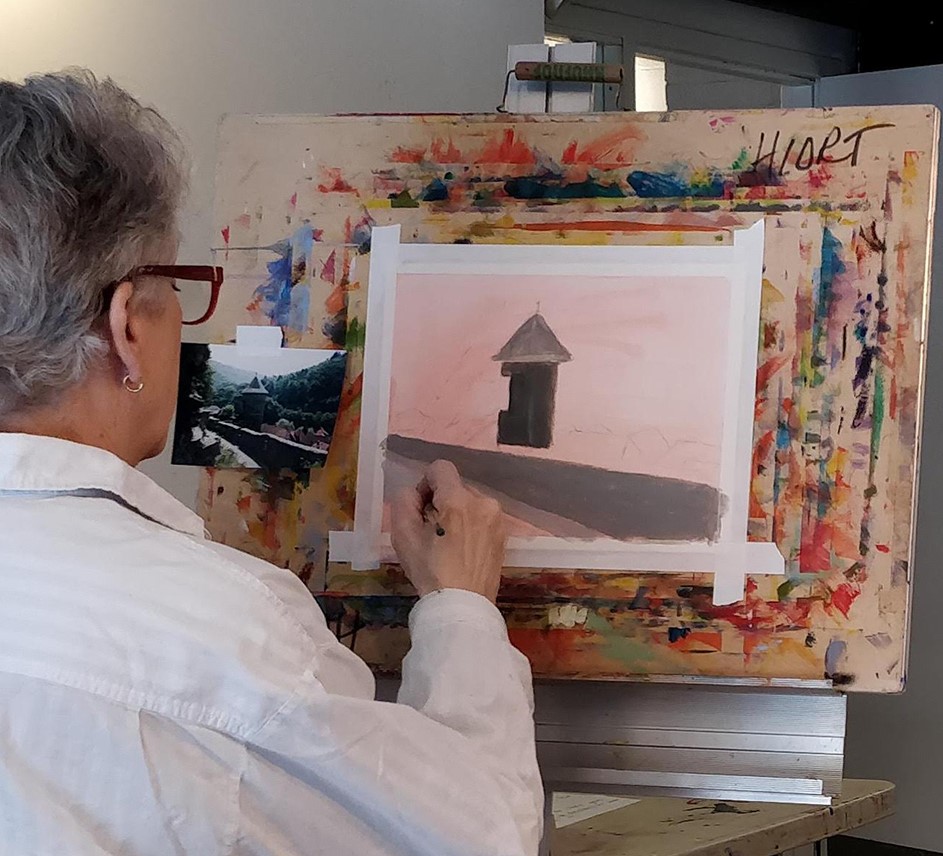 Painter painting a house in acrylic