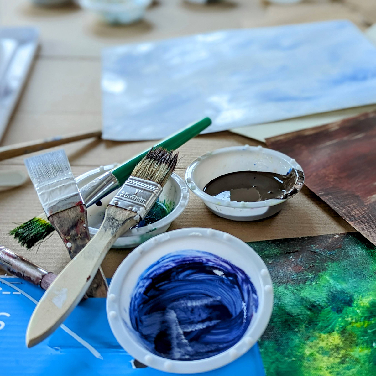 Paint brushes and blue paint