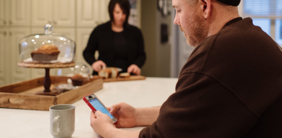 WSB Customer using his mobile banking app to check his accounts.