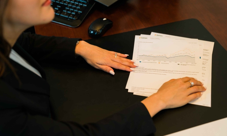 Financial advisor showing documents to customers.