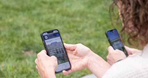 Parents checking their WSB accounts on their WSB Mobile Banking apps.