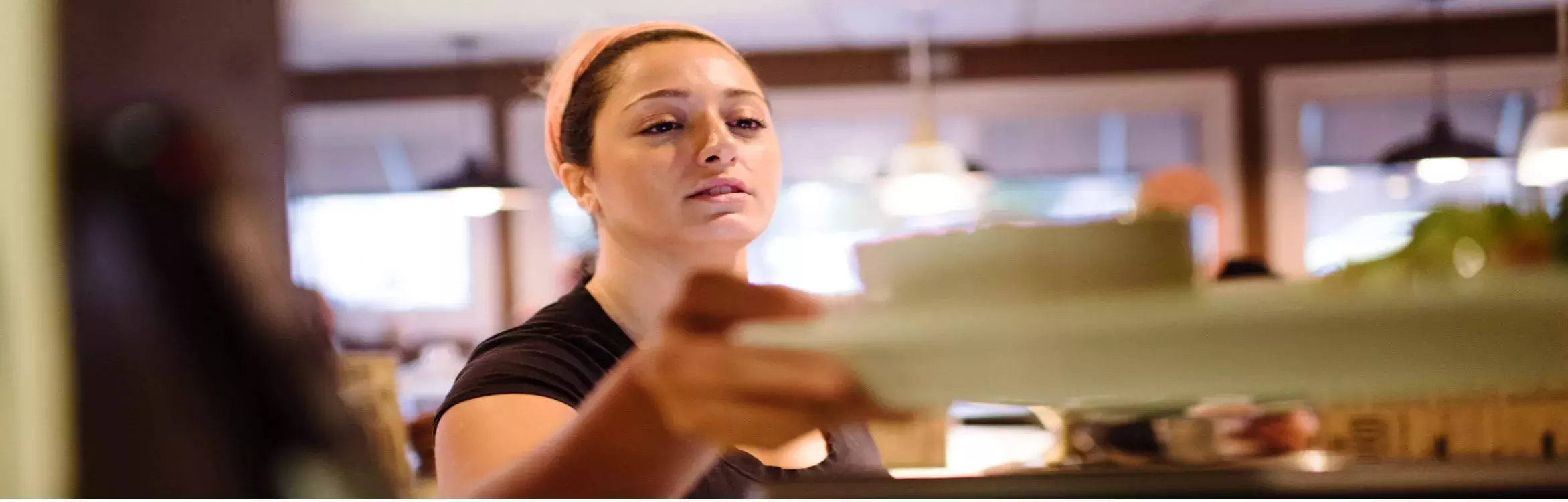 Waitress picking up a meal