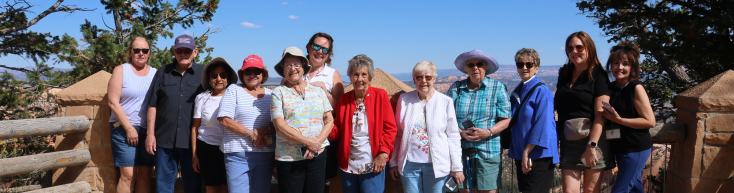 A group photo of Club 50 members during a trip to the Grand Canyon.