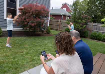 Parents checking their bank accounts on the WSB Mobile Banking app.