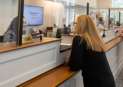 A WSB Teller helping a customer.