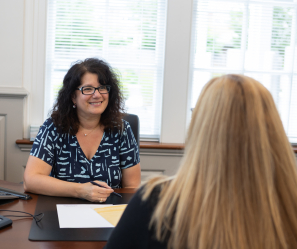 Personal Banker helping a customer in a meeting.