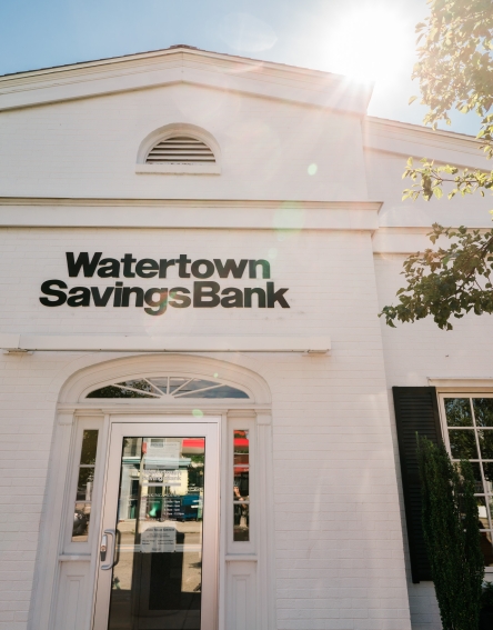 White building with the name Watertown Savings Bank at the Bigelow Branch