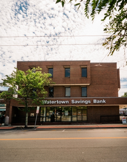 Brown building with the name Watertown Savings Bank on it, which is the Waverley Square Branch.