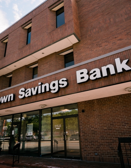 Brown brick building with the name Watertown Savings Bank on it.