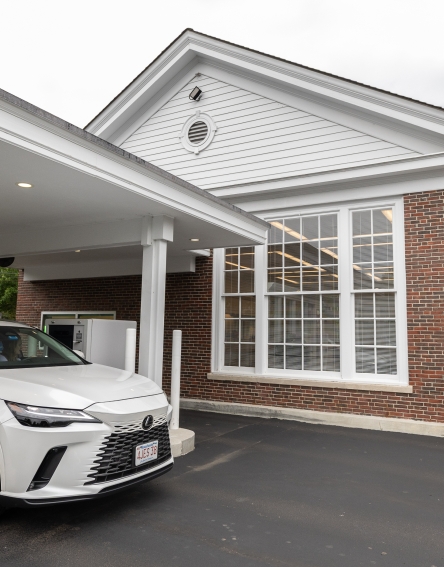 White car passing through the drive-thru at the Warrendale Branch.